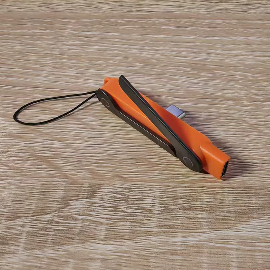 VBNM 2-in-1 Tragbarer Faltbarer Handyständer mit 360-Grad Drehbarkeit und 240W USB-C zu Typ-C OTG Adapter in Orange - Bild 3
