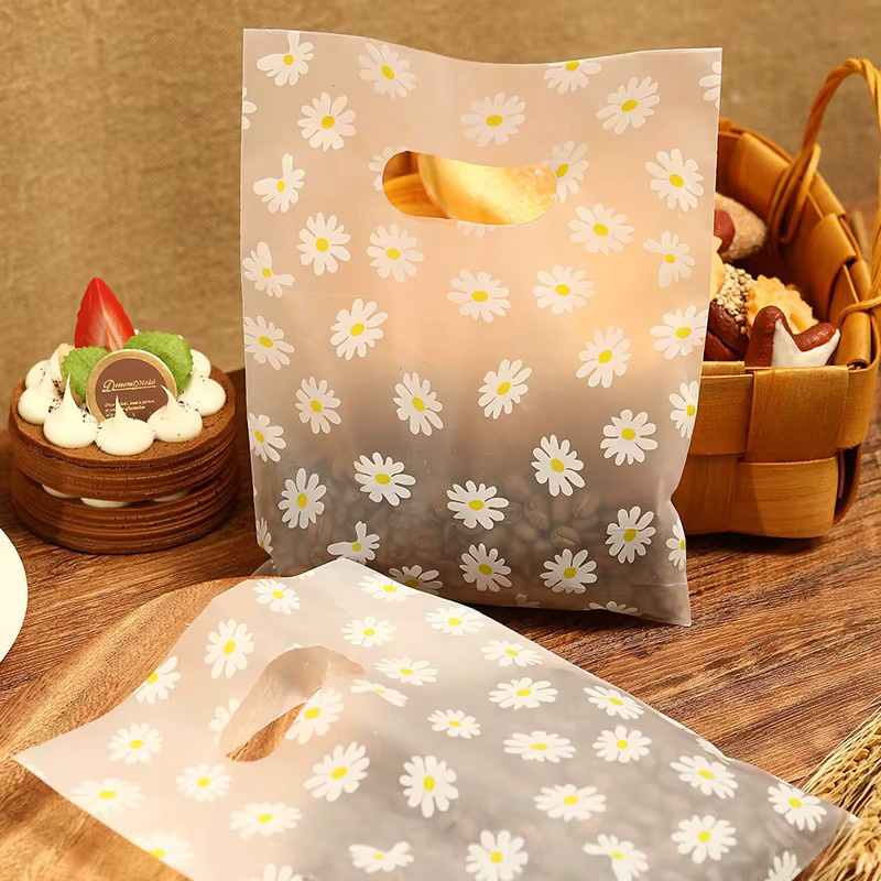 100 Stück Gänseblümchen-Geschenktüten aus Kunststoff mit Griff in Weiß - Bild 2