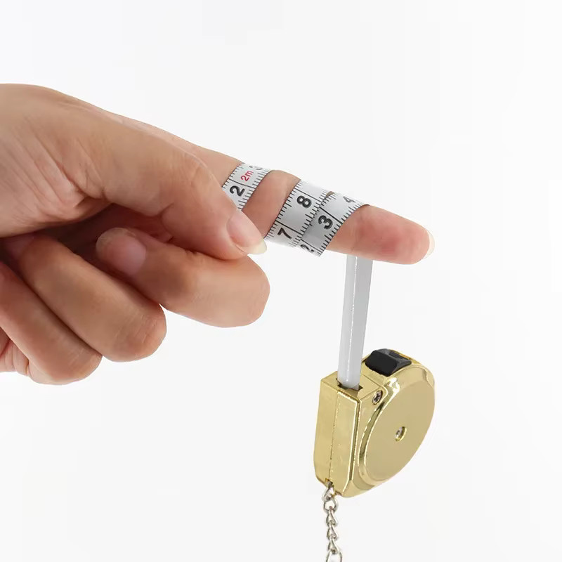 Tragbares Mini-Maßband aus Stahl in Silber und Multicolour, einziehbar mit Schlüsselanhänger-Design, 2 m Messlänge - Bild 2