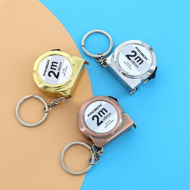 Tragbares Mini-Maßband aus Stahl in Silber und Multicolour, einziehbar mit Schlüsselanhänger-Design, 2 m Messlänge - Bild 1