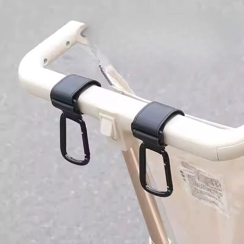 Multifunktionaler Kinderwagen Haken aus Leder mit Klettverschluss in Pink für Babywagen und Fahrräder - Bild 1