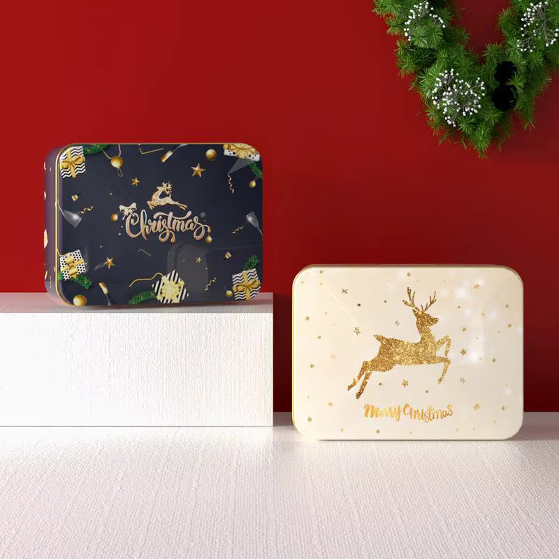 Weihnachtliche Metall-Süßigkeitenbox aus Weißblech mit Elch- und Weihnachtsmann-Motiv in Weiß und Mehrfarbig - Bild 1