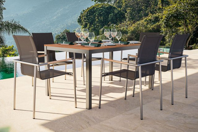 OUTFLEXX Garten-Essgruppe mit Ausziehtisch und 6 Diningsesseln aus Teakholz, Edelstahl und Textilene in Anthrazit und Natur - Bild 1