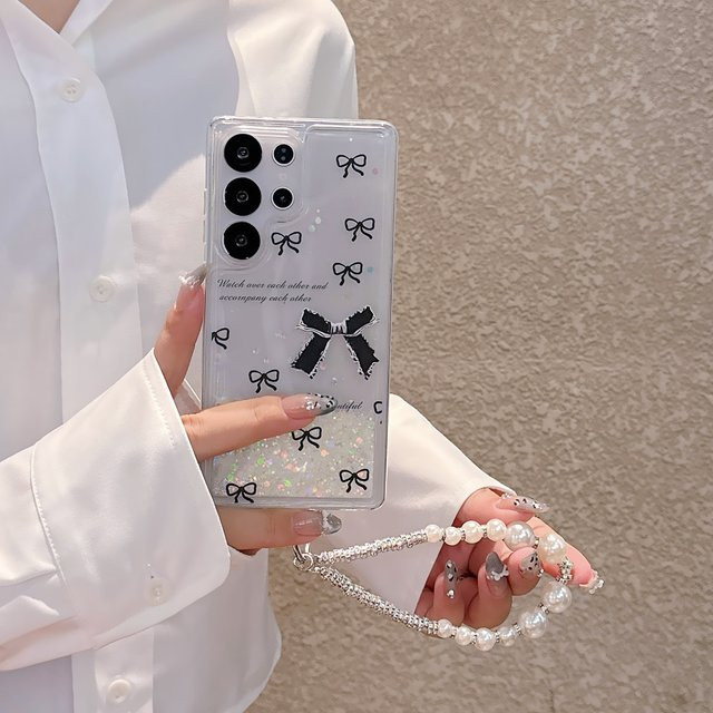 Luxuriöse Glitzer-Schutzhülle mit Treibsand-Effekt und schwarzer Schleife für Samsung Galaxy S22 Plus, S23, S24 und S25 Ultra inklusive Trageband in Schwarz - Bild 1