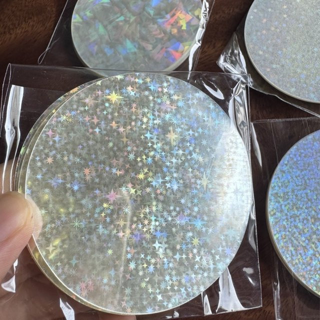 100 Stück Runde Laser-Film-Abzeichenhüllen mit Sternmuster aus transparentem PVC für DIY-Projekte - Bild 1