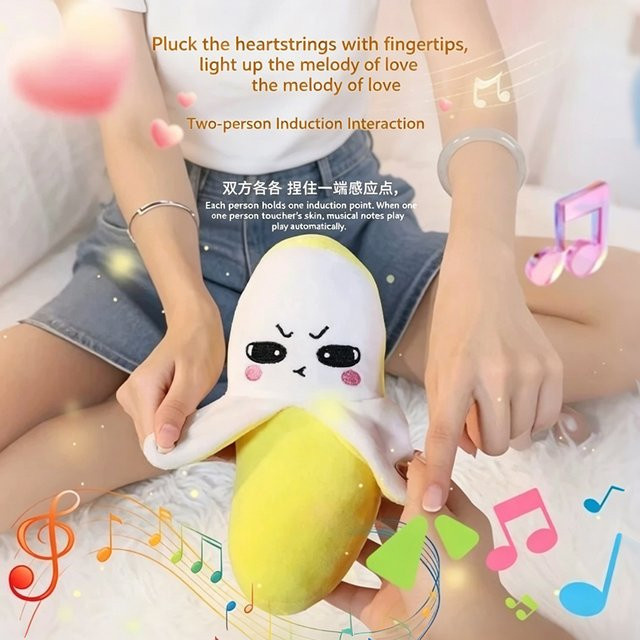 Bandai Interaktive Plüsch-Bananenpuppe, mit Musikrhythmus, ab 14 Jahre - Bild 1