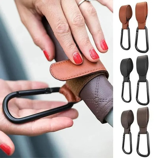Einstellbarer Kinderwagen Haken aus PU Leder für Windeltaschen und Zubehör in Schwarz oder Braun - Bild 1