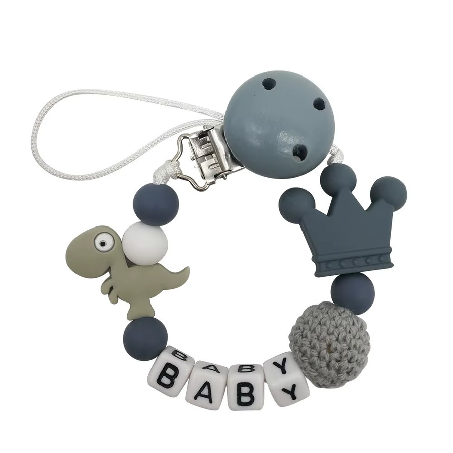 Panplay Schnullerkette aus Holz mit Dinosaurier-Motiv in Bunt für dein Baby - Bild 1