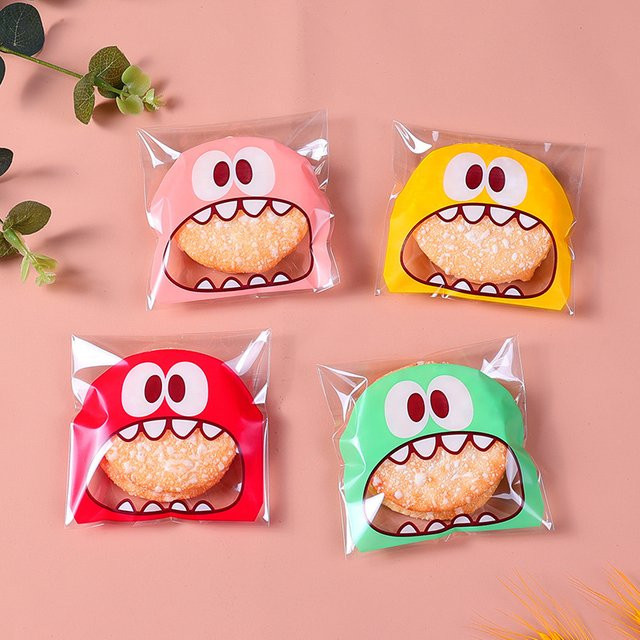 100 Stück Cartoon Monster Kunststoff-Süßigkeitenbeutel mit Selbstklebeverschluss in Pink und Multicolour für DIY Kekse und Snacks - Bild 1