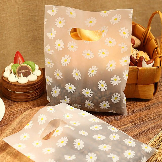 100 Stück Geschenktüten mit Gänseblümchenmuster und Kunststoffgriff in Weiß - Bild 1