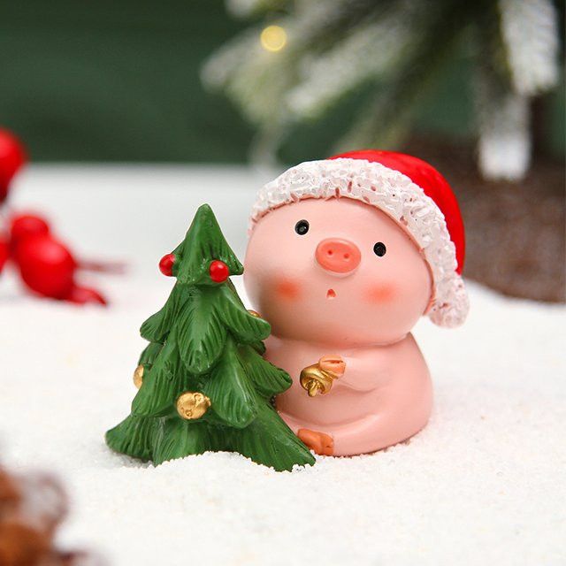 Kreative Weihnachtsdekoration aus Harz in Form eines rosa Schweins mit Weihnachtsbaum als Tischdekoration - Bild 1