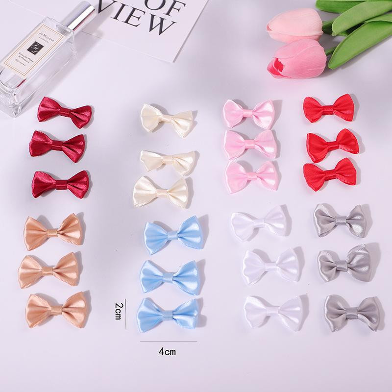 Kleine Taillenschleife mit Polka Dots aus Polyester in Light Pink, B/B: 4 x 2,5 cm - Bild 1