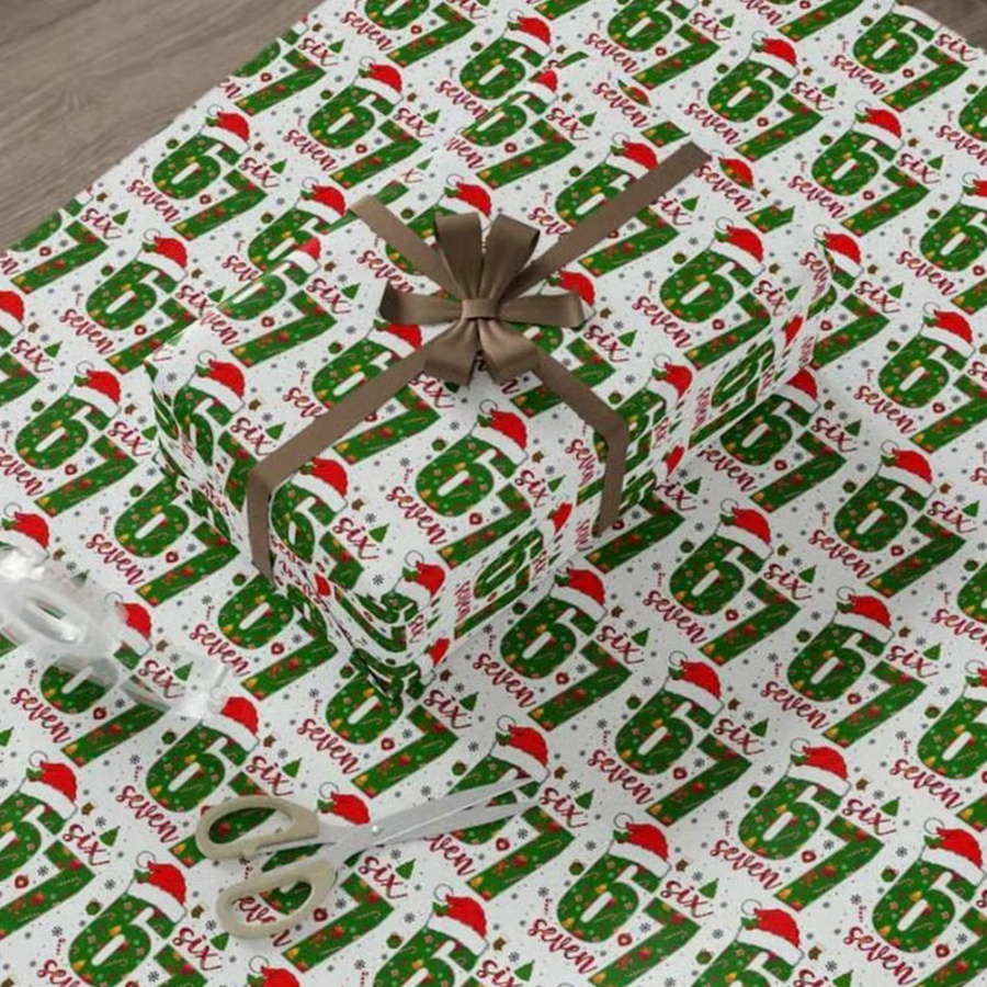 Weihnachts-Geschenkpapierbögen mit lustigem Weihnachtsmann Motiv in Lila - Bild 1