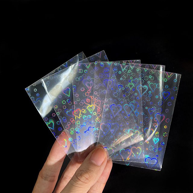50 Stück transparente Kartenhüllen mit Herz-Design für Sammelkarten und Kpop-Fotos aus Kunststoff - Bild 1