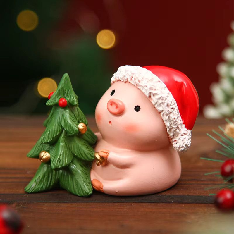 Kreative Weihnachtsdekoration aus Harz in Form eines rosa Schweins mit Weihnachtsbaum als Tischdekoration - Bild 4