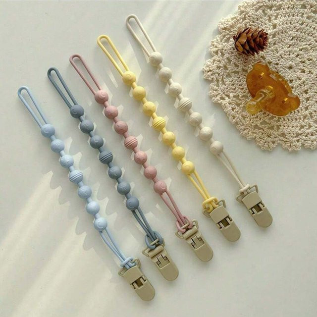 Mumamuying Baby Schnuller Kette mit integriertem Silikon Beißring in Weiß, BPA-frei - Bild 1