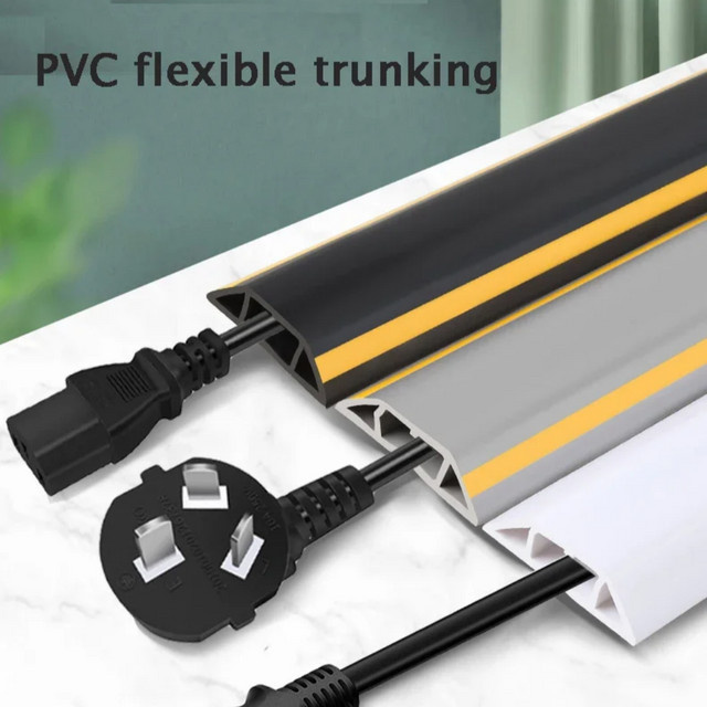 Selbstklebende Bodenkabelabdeckung aus PVC in Schwarz für Kabelmanagement und Stromkabelschutz - Bild 1
