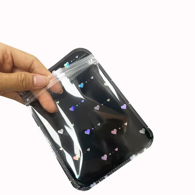 50 Stück wiederverschließbare Mylar-Beutel mit Schwarz-Weiß-Laserherz-Design und Reißverschluss zur Lebensmittelaufbewahrung und Verpackung, Schwarz-Weiß - Bild 3