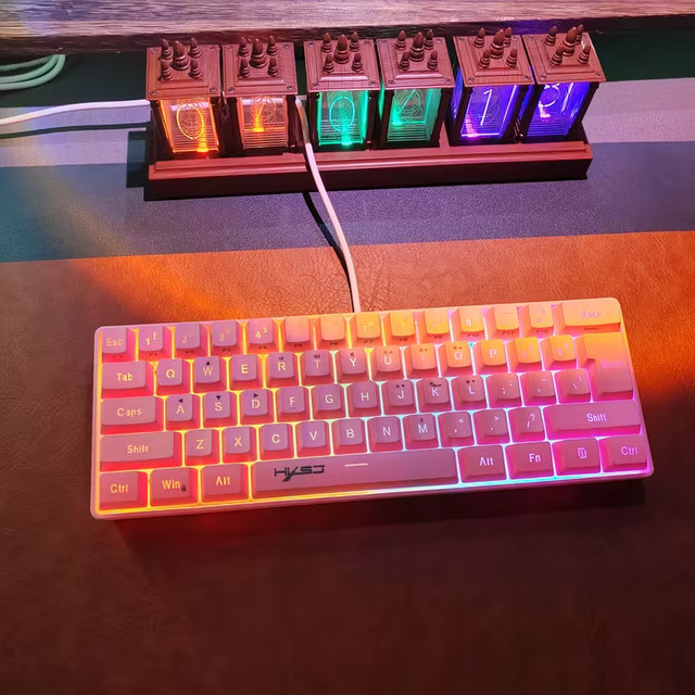 HXSJ RGB-Gaming-Tastatur in Pink, kompakte 60 % Tastatur mit 61 Tasten und USB-Anschluss, kompatibel mit PC, Mac und Laptop - Bild 1