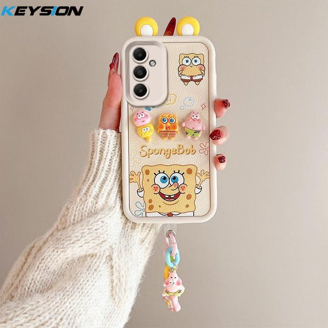 KEYSION 3D Cartoon Handyhülle mit Armband für Samsung Galaxy A55 5G, A35, A25 und A15, weiches Silikon, stoßfest, mehrfarbig - Bild 1