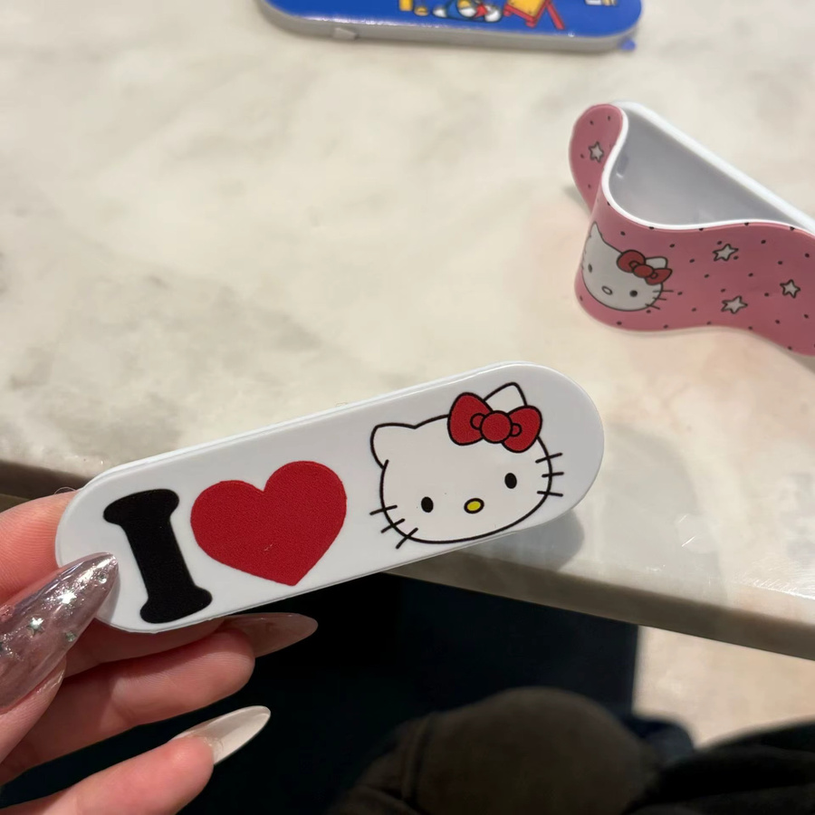 Sanrio Hello Kitty Handyhalterung im Pflaster-Design als universeller Push-Pull-Ständer für dein Smartphone - Bild 3