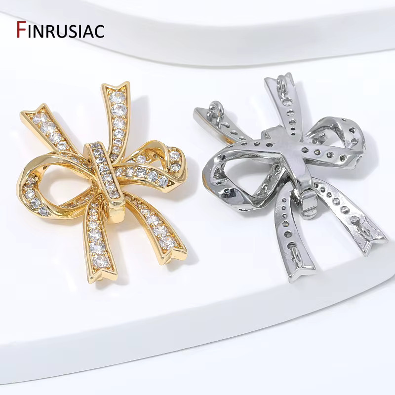 FINRUSIAC Perlenverbinder, 14K vergoldetes Messing, Zirkonia, Schleifenknoten - Bild 1