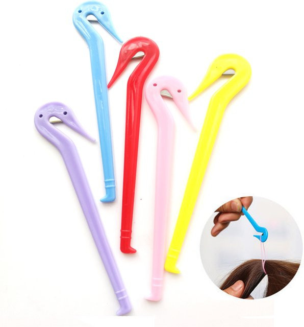 Einweg-Haargummi-Entferner aus Kunststoff in Multicolour zur einfachen Entfernung von elastischen Haarbändern und Kopfbedeckungen - Bild 1