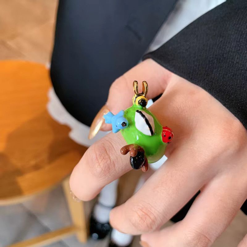 DINGABIYU Stapelring Frosch in Grün und Multicolor mit Öl tropfender Puppe - Bild 2