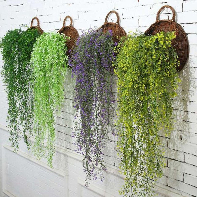 Künstliche Rattan-Reben als hängender Wandbehang mit grünen Blättern und Blumen in Bohemian-Stil - Bild 1