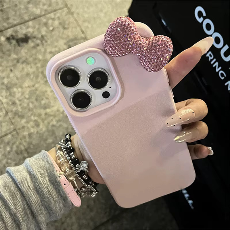 Luxus Handyhülle mit Strass-Schleife und Litschi-Muster aus Leder für Apple iPhone in Pink - Bild 2