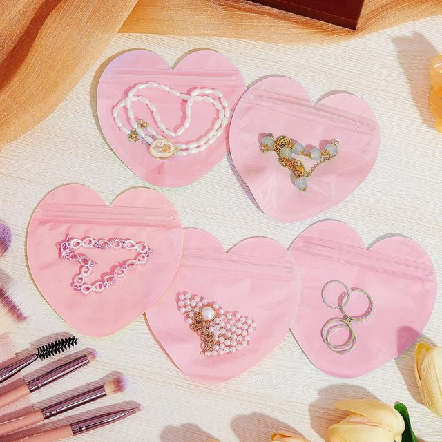 100er Set herzförmige Schmuckverpackungsbeutel aus Kunststoff, transparent und versiegelbar, Farbe: Pink - Bild 1