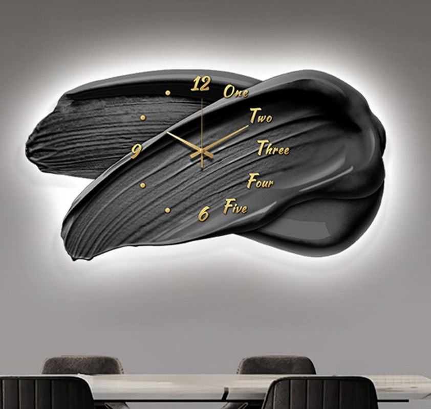 Oeny Moderne Wanduhr in Schwarz mit Beleuchtung und geräuschlosem Analog-Uhrwerk, abstrakte Wanddekoration in unregelmäßiger Form - Bild 1