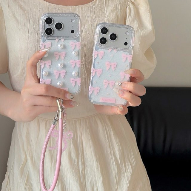 Glitzernde 3D Schmetterlings-Schleife Handyhülle mit Perlen und Lanyard für iPhone 17 Pro Max, 16 Pro, 15 Plus, 14, 13 in Pink - Bild 1