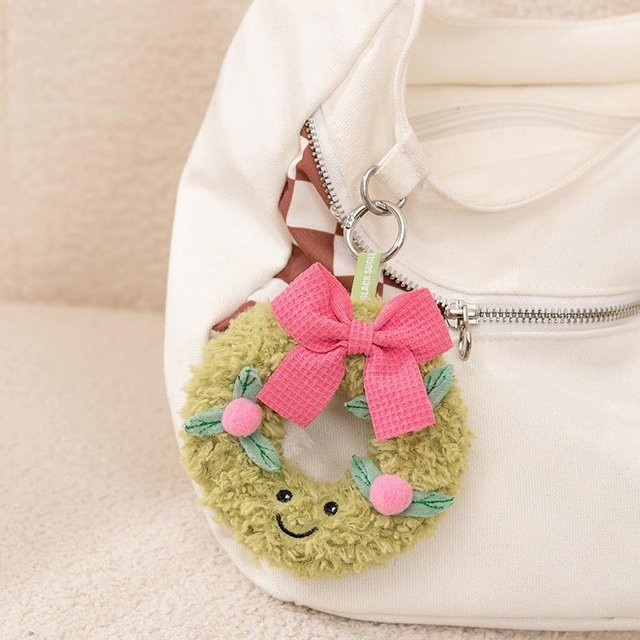 Yiran toy Plüschtier, grüner Kranz, rosa Fliege, Plüsch / Textil - Bild 1