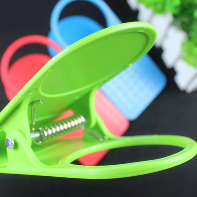Getränkehalter mit Binder-Clip zur Befestigung am Schreibtisch aus Kunststoff - Bild 1