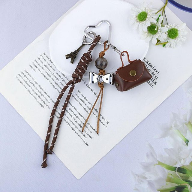 XYNN Schlüsselanhänger Lederseil, Kirschschleife, Herz, braun, Unisex - Bild 1