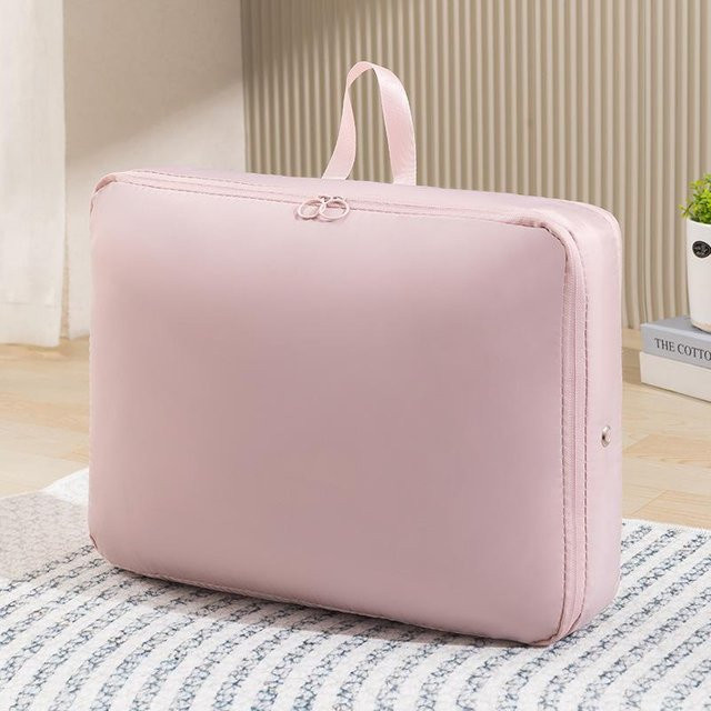 Tragbare selbstkomprimierende Aufbewahrungstaschen aus Stoff in Rosa, wasserdichte erweiterbare Organizer mit Reißverschluss und Tragegriff für Bettzeug, B/T/H: 40 x 30 x 12 cm - Bild 1