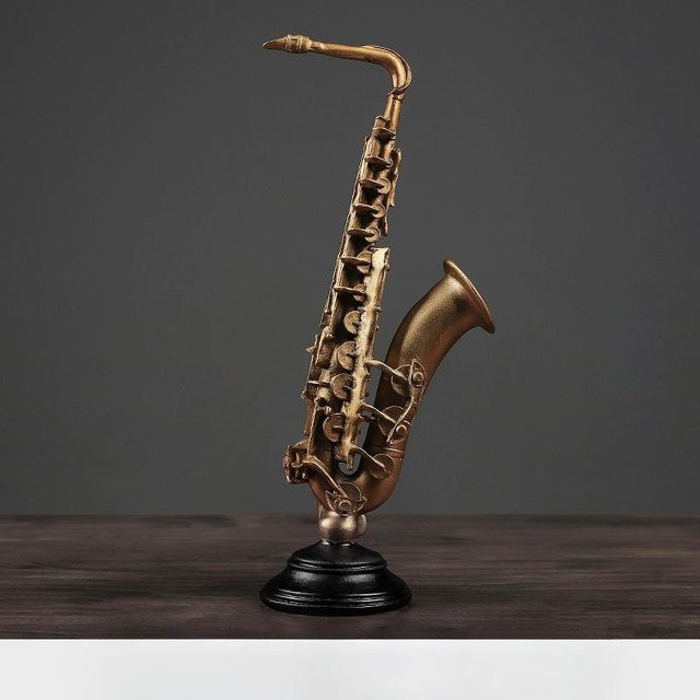 Dekorative Musikinstrumenten-Figuren aus Harz in Gold für deine Tischdekoration als Kunstwerk für dein Zuhause - Bild 1