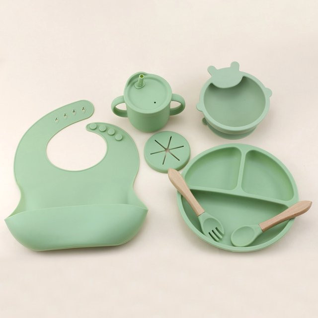 7-teiliges Silikongeschirr-Set für Babys mit Lätzchen, Speiseteller und 2-in-1-Wasserbecher-Schüssel mit Saugnapf in Blau und Grün - Bild 1