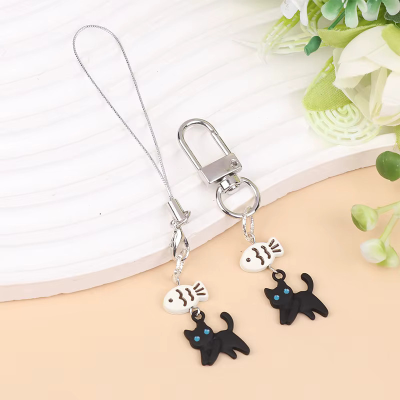 JINHF Kawaii Y2K Telefonanhänger mit Katze oder Kaninchen in Schwarz als dekoratives Zubehör für Kamera, Kopfhörer und Schultaschen - Bild 1