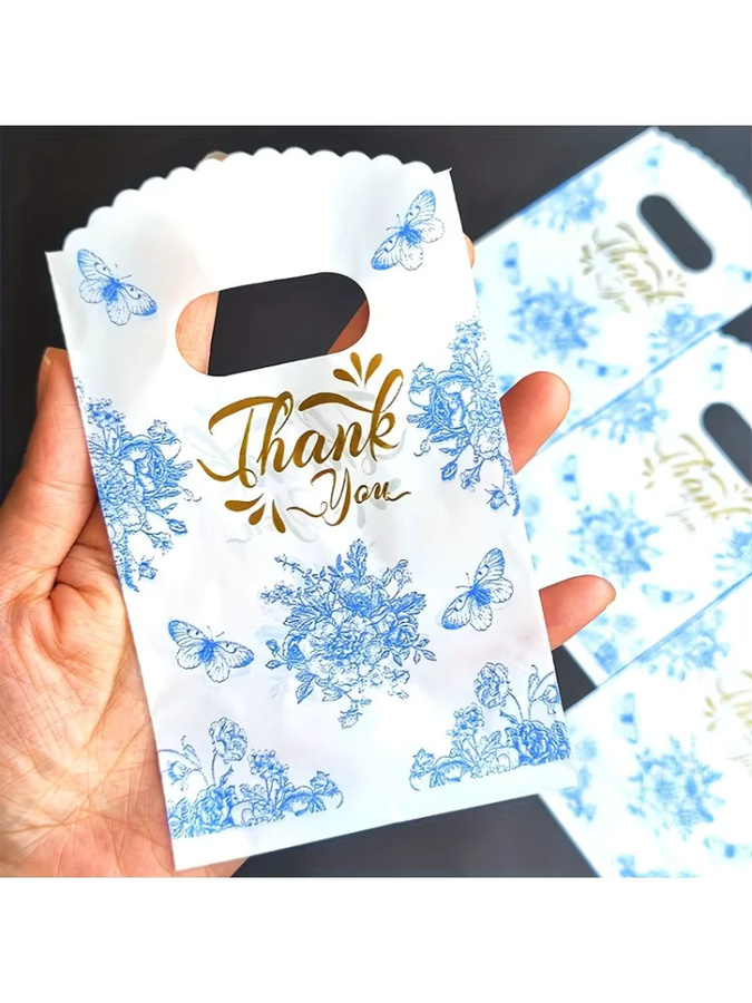 Blaue Geschenktüten aus Papier mit Schmetterlingsdruck und Blumenmuster für besondere Anlässe und Partys - Bild 4