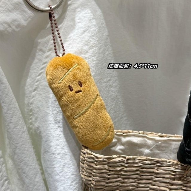 Plüsch-Croissant-Rucksackanhänger, Unisex - Bild 1