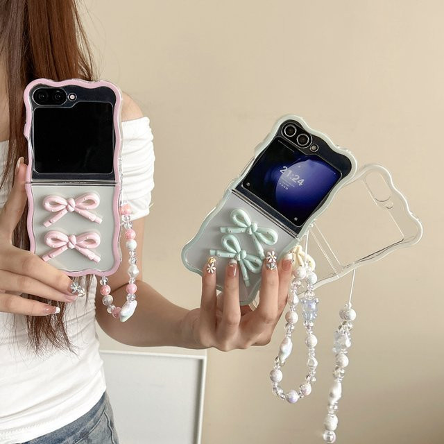 Stoßfeste Silikonhülle für Samsung Galaxy Z Flip 7, 6, 5, 4, 3 mit 3D-Schleife und Lanyard-Armband im gewellten Rand-Design - Bild 1
