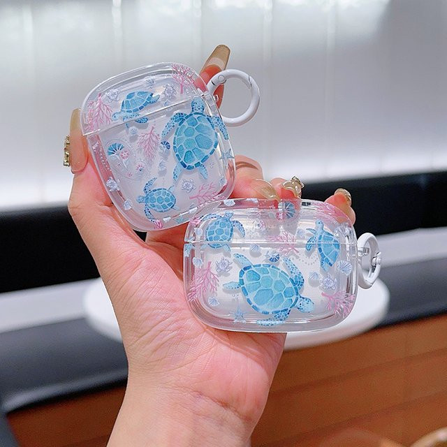 Ocean Series Schutzhülle für Apple AirPods 1 2 3 und AirPods Pro 2 aus Soft TPU mit Schlüsselanhänger in Blau oder Transparent - Bild 1