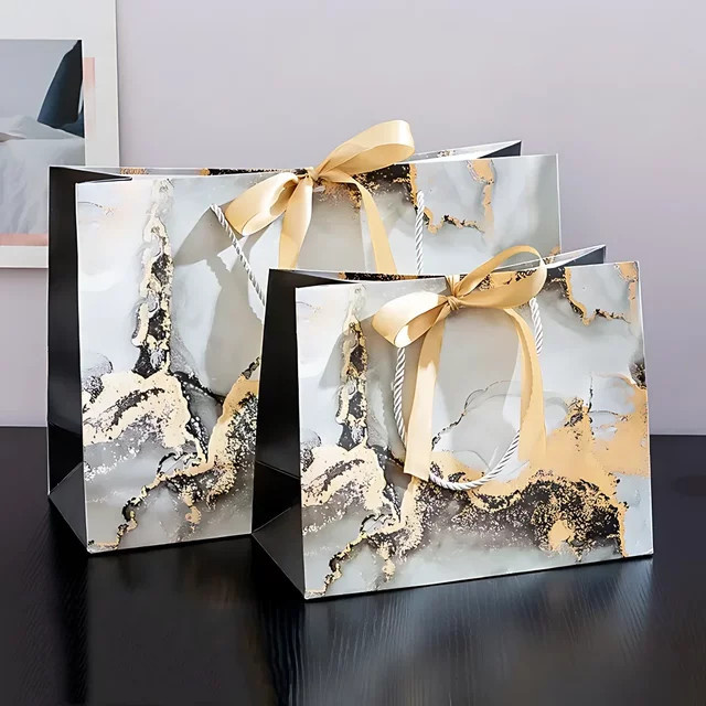 Marmorierte Geschenktüten aus Papier mit Band in Grün und Multicolour - Bild 1