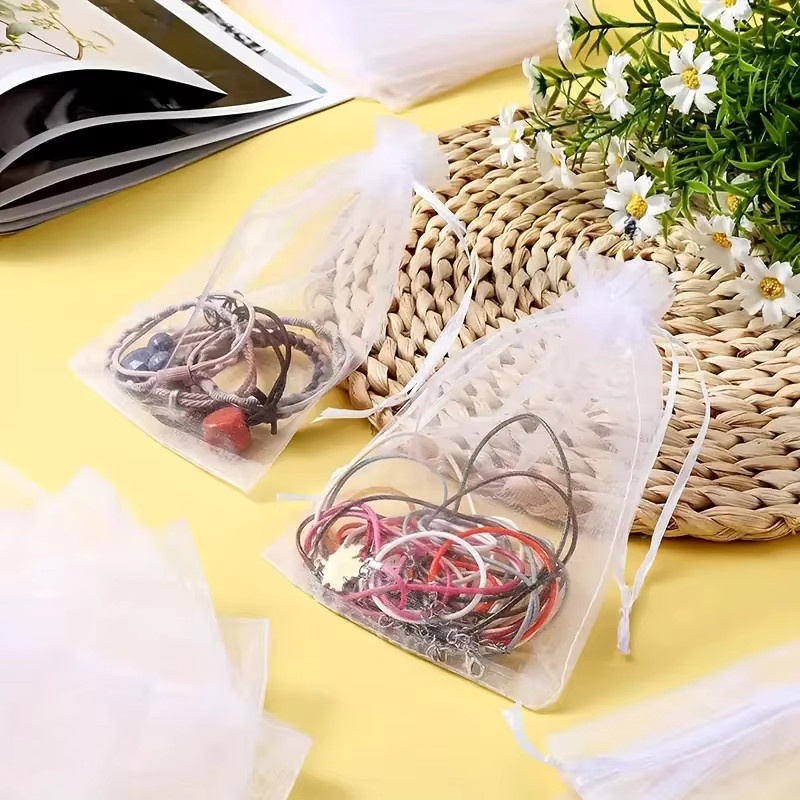 100 Stück weiße transparente Organza-Schmuckbeutel mit Kordelzug für Hochzeiten, Partys und Geschenke - Bild 4