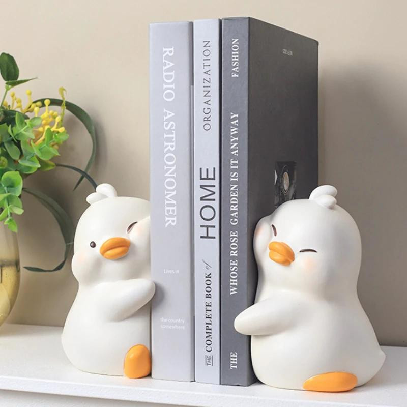Set aus 2 süßen Enten Buchstützen aus Harz als dekorative Tierfiguren für deinen Schreibtisch oder dein Wohnzimmer - Bild 1
