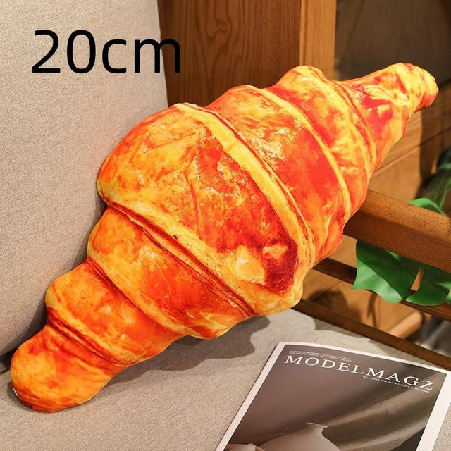 Yiran Health & Beauty Croissant Plüschkissen in Orange mit realistischem Lebensmittel-Design - Bild 1
