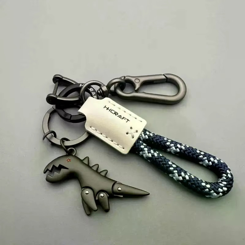 Schlüsselanhänger Dinosaurier-Auto, Leder, gewebtes Seil, Metall, Unisex - Bild 2
