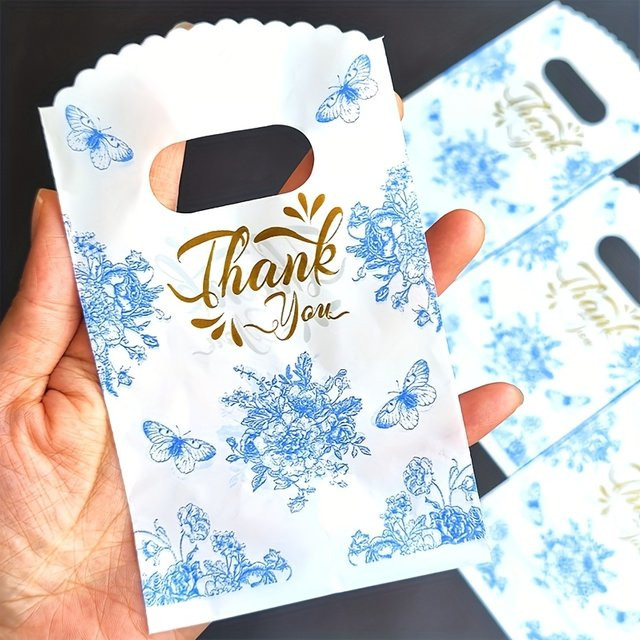 Blaue Geschenktüten aus Papier mit Schmetterlingsdruck und Blumenmuster für besondere Anlässe und Partys - Bild 1